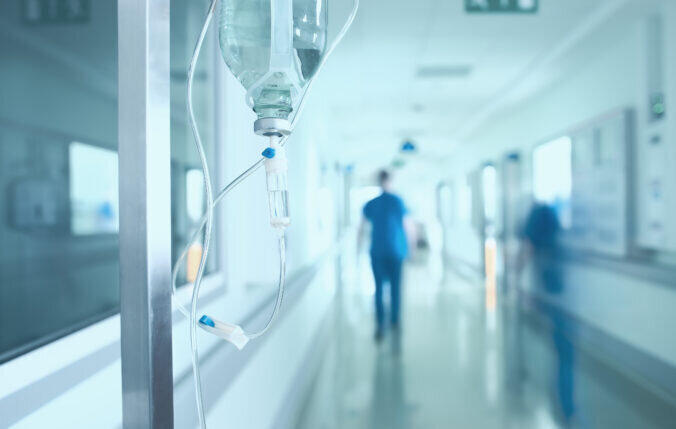 An IV drip in a hospital corridor