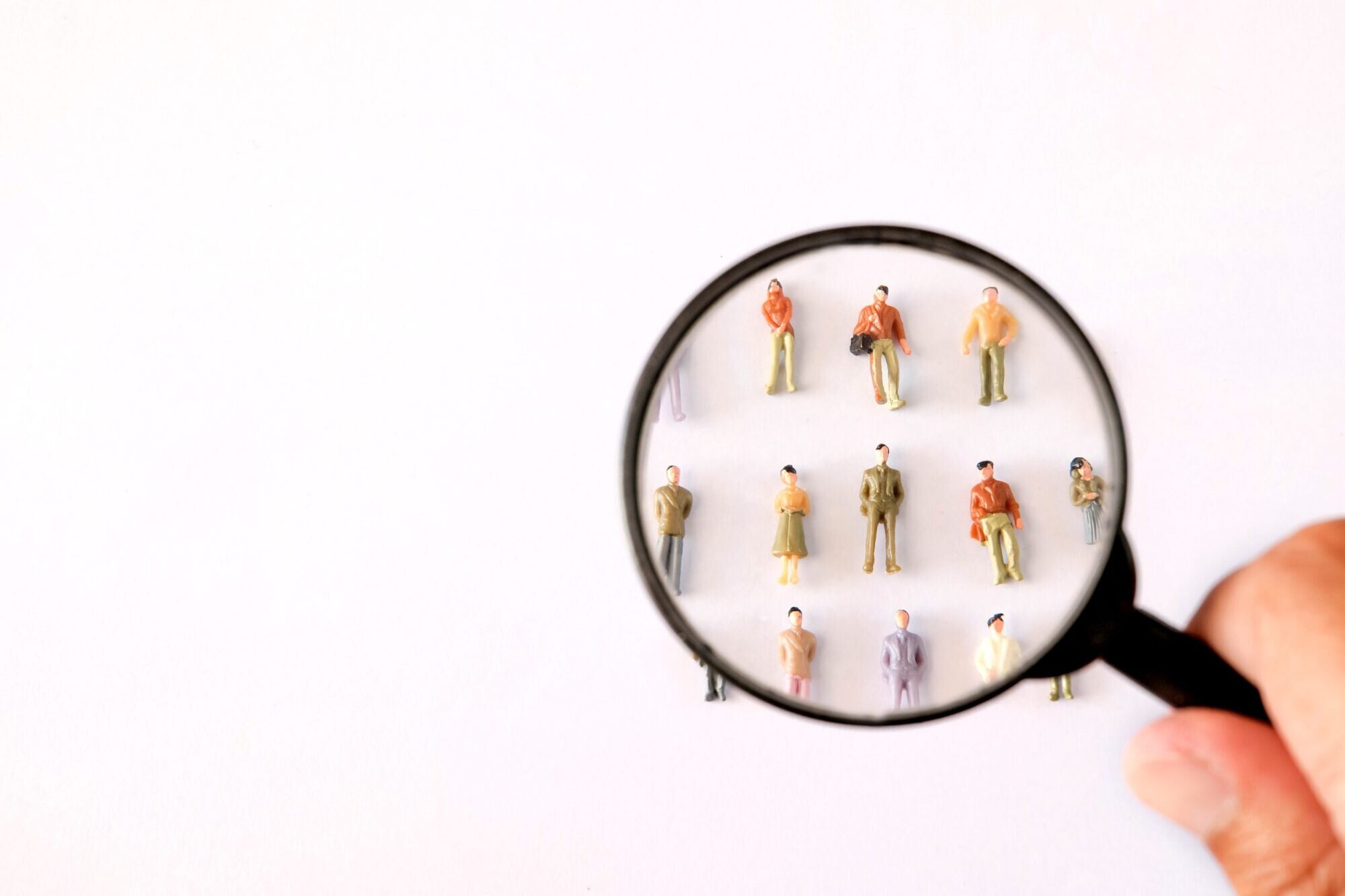 A magnifying glass focusing on people