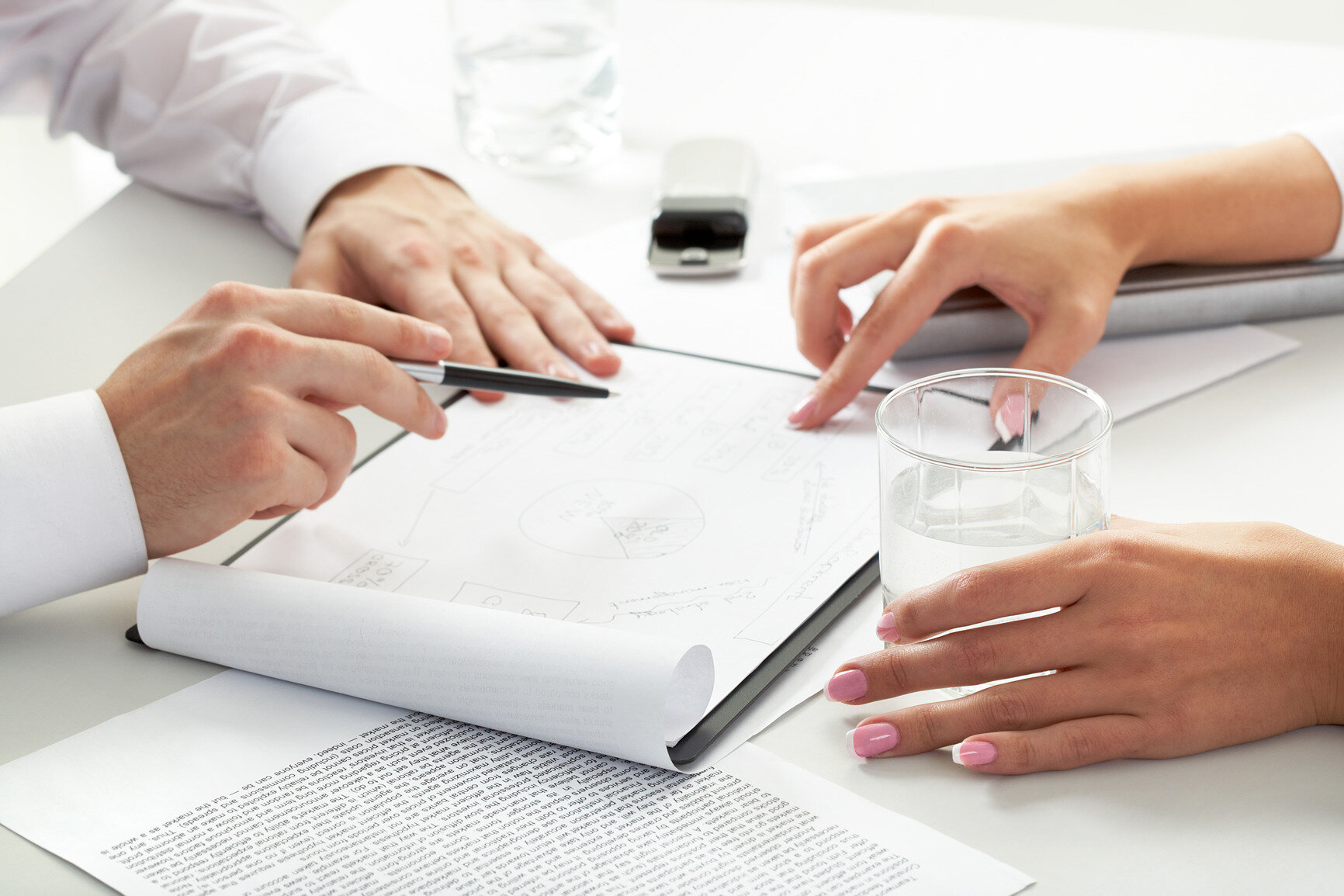 Two people consulting a sketch