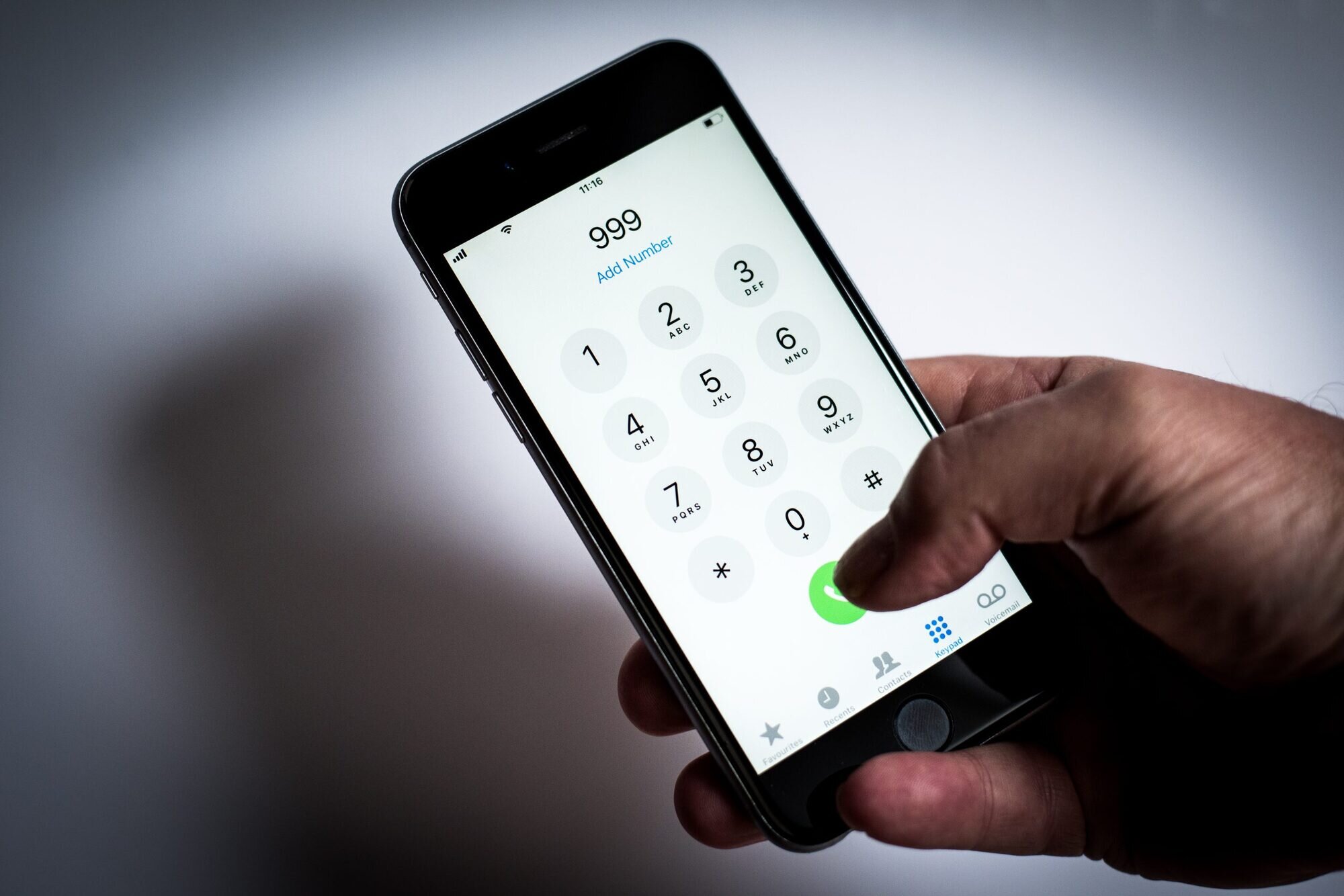 Person about to call someone on a mobile phone