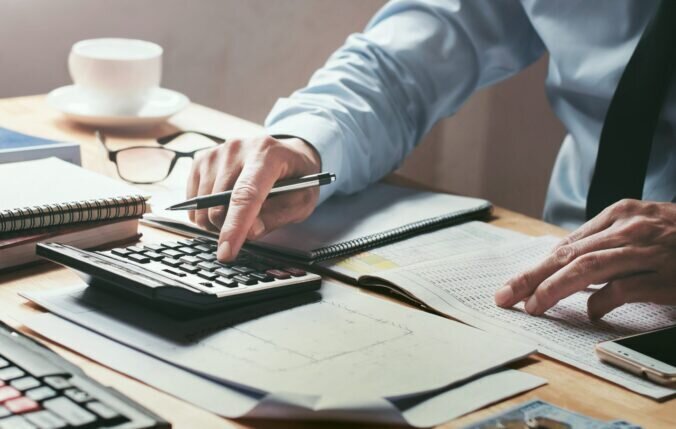 A person using a calculator