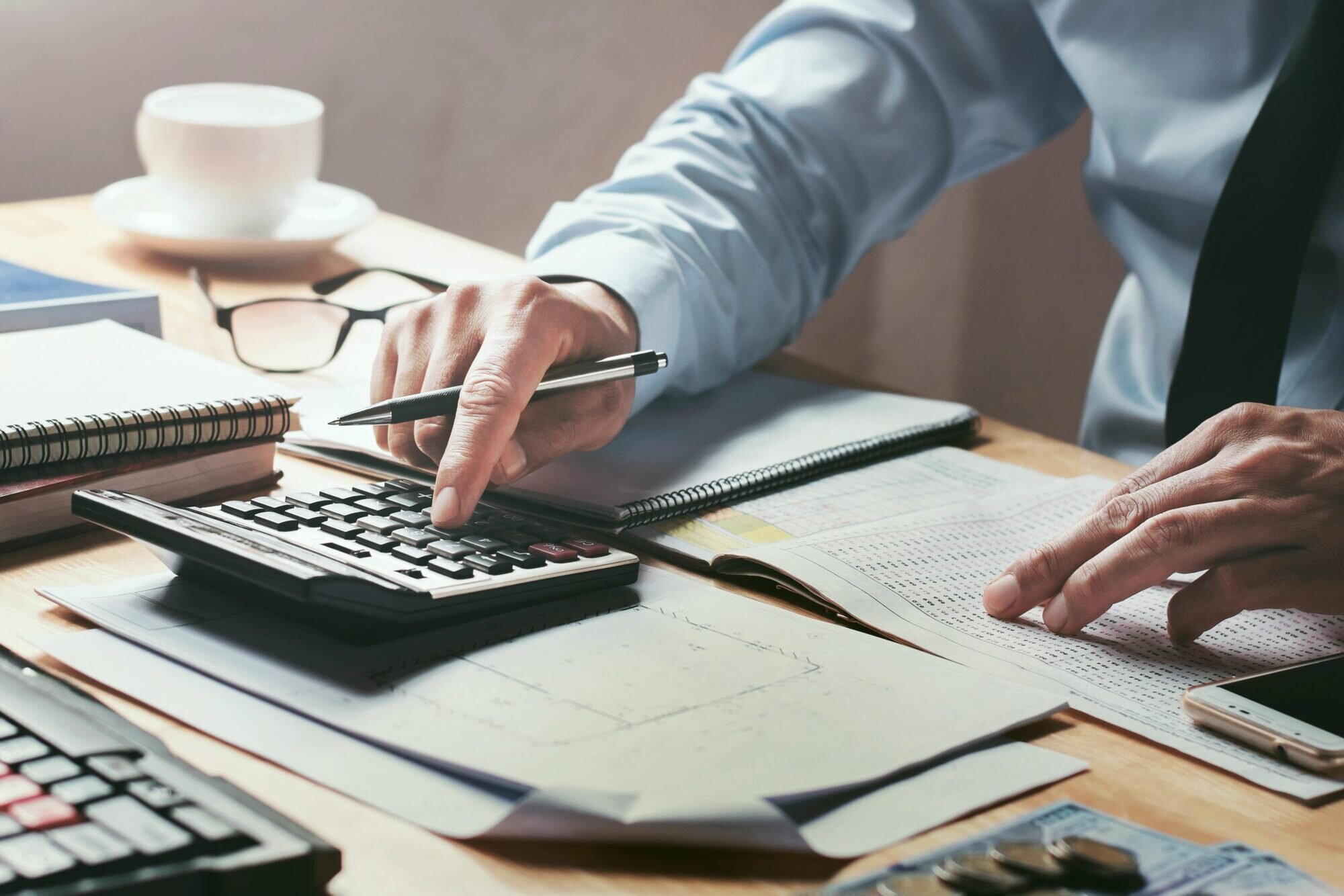 A person using a calculator