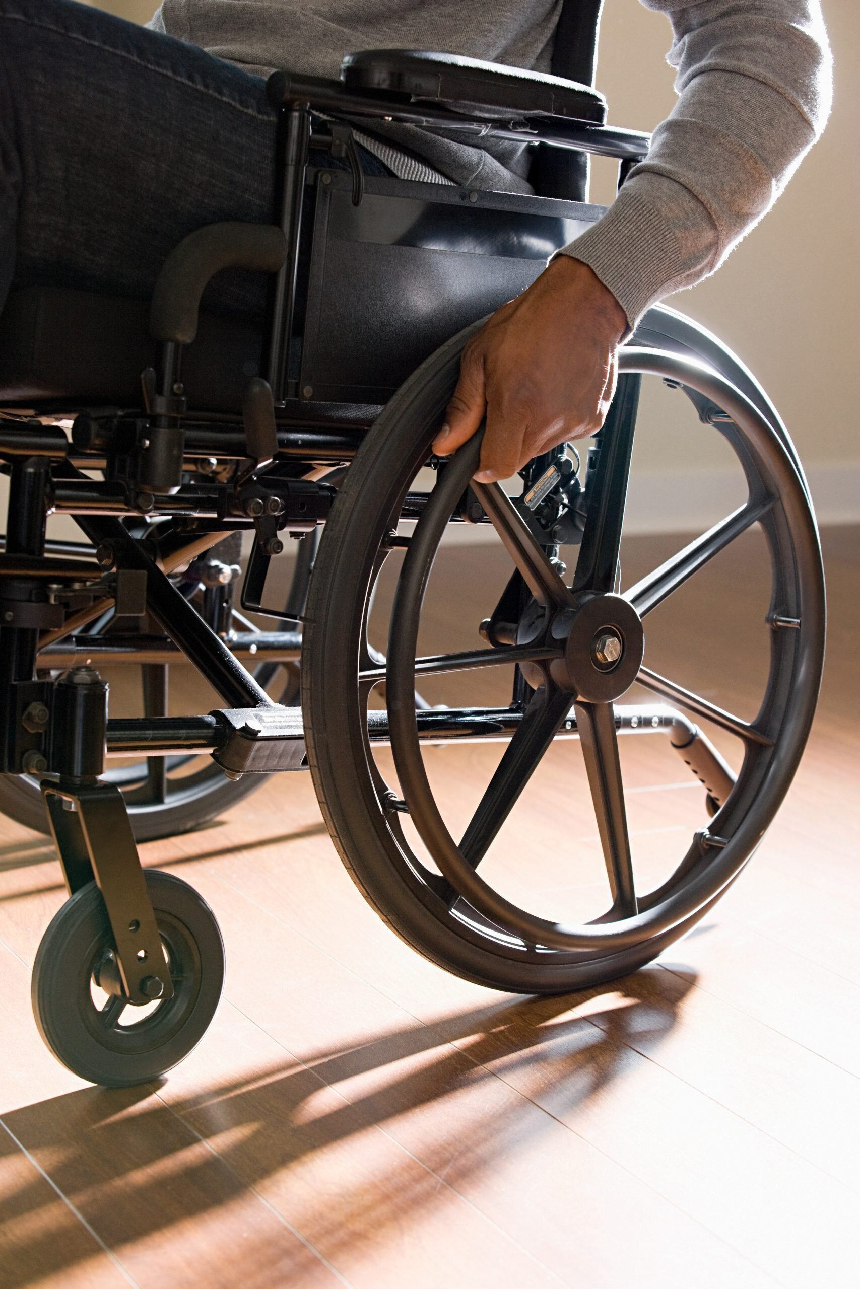 Unrecognisable man in a wheelchair