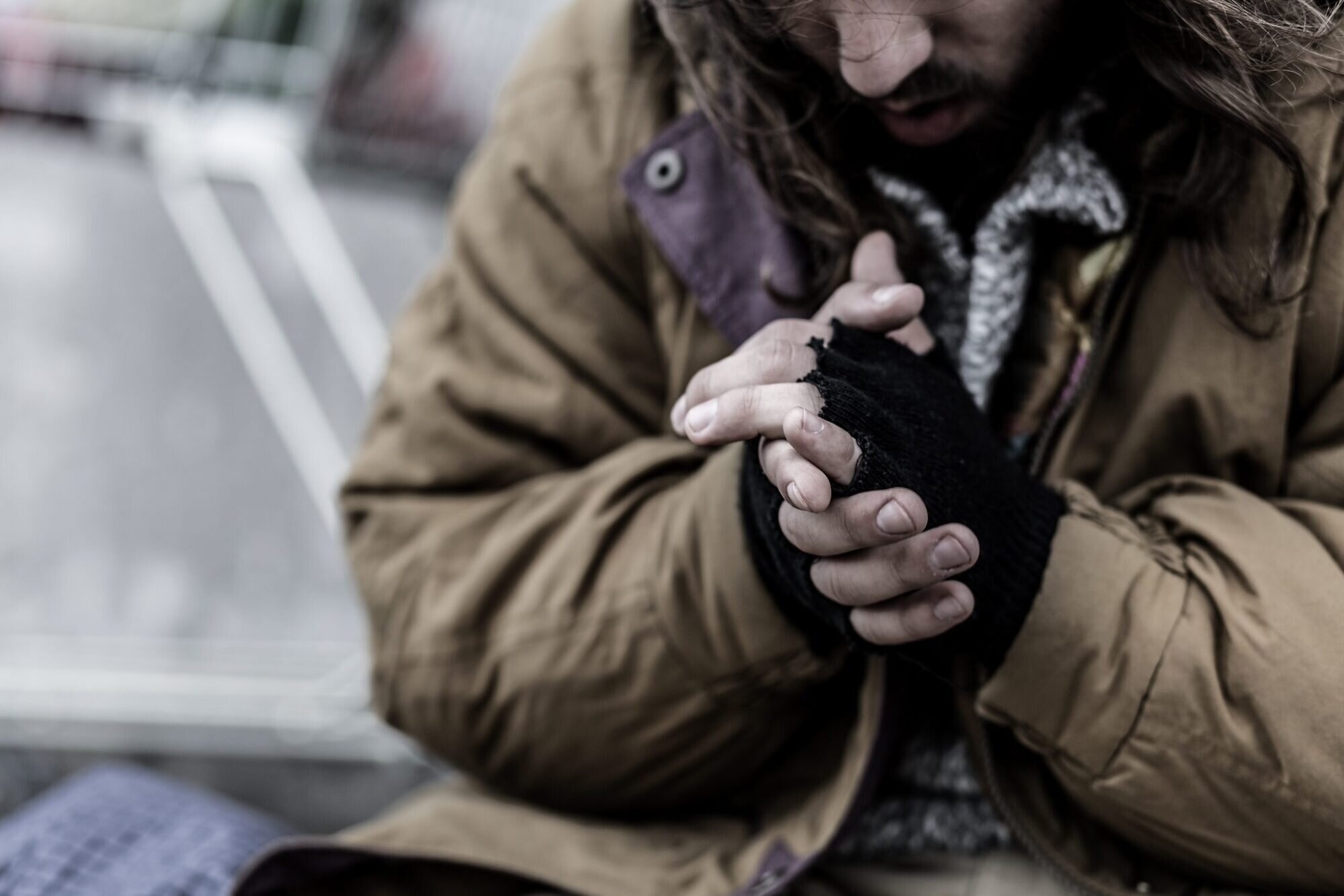 Close-up Of Dirty and Cold Hands Of Homeless Person
